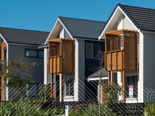 A row of two storey townhouses on a residential street